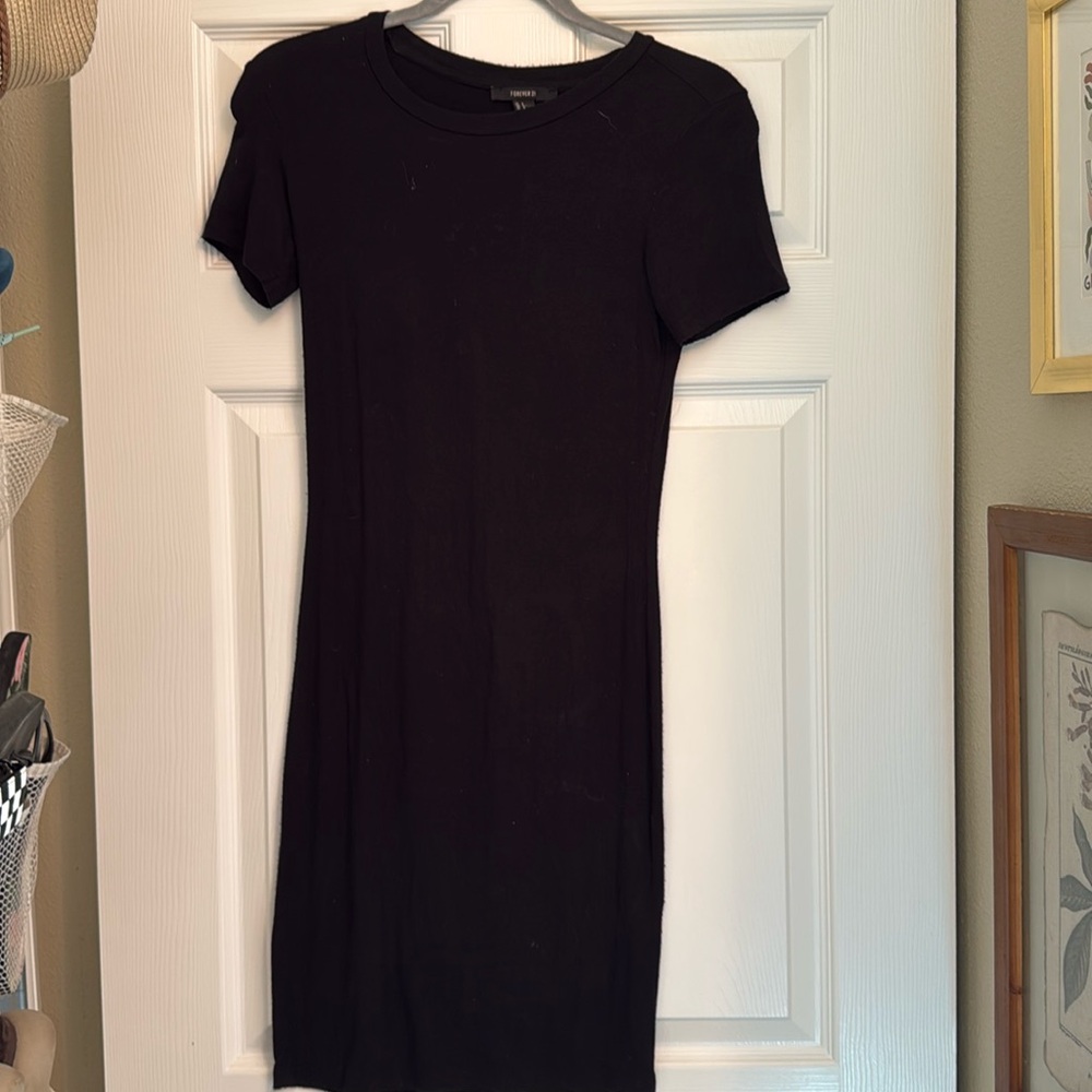 Plain black, below the knee, stretchy dress